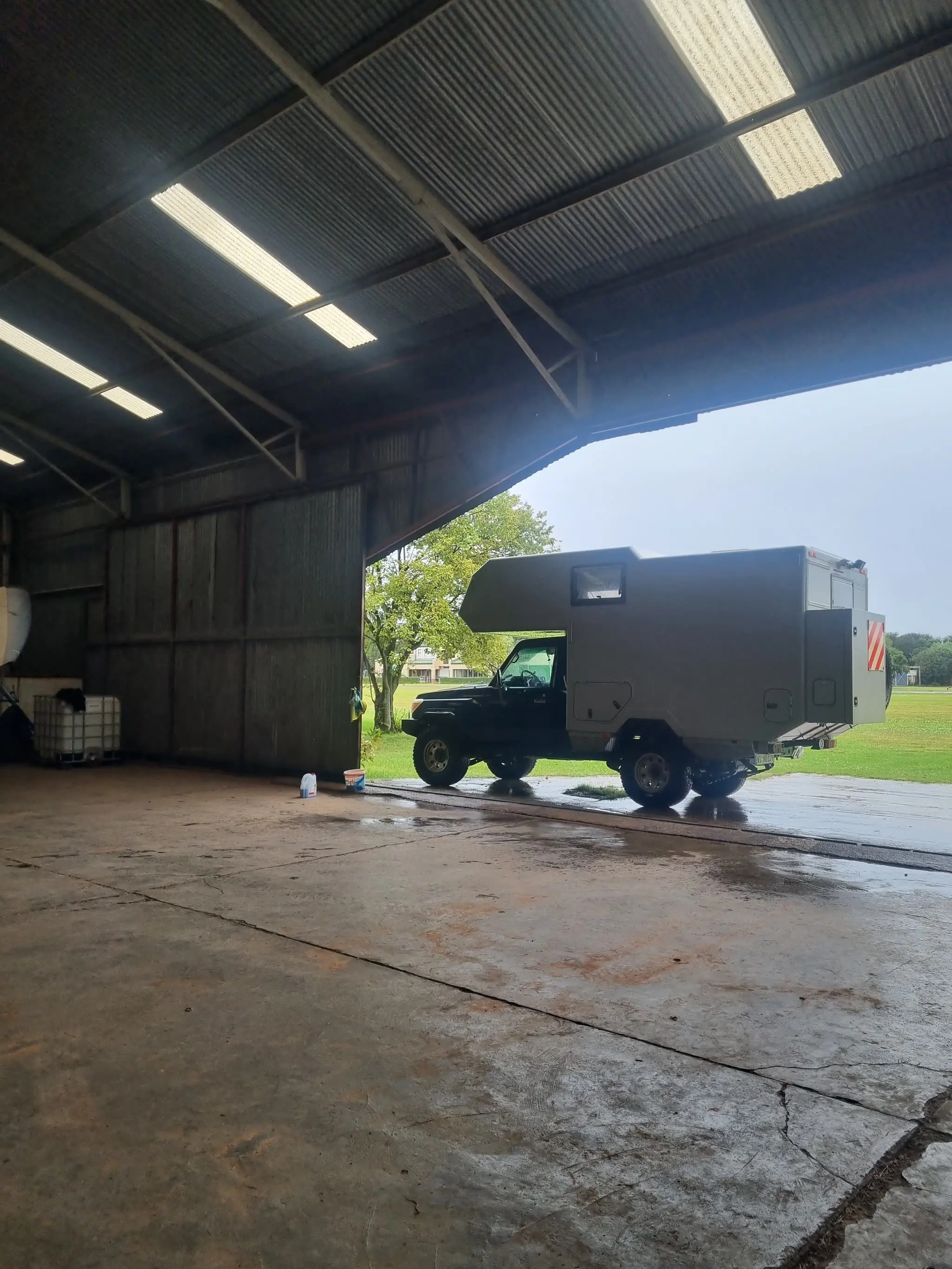 A vehicle during its monthly check. Battery, tyres, fluids, photographed for the owner.